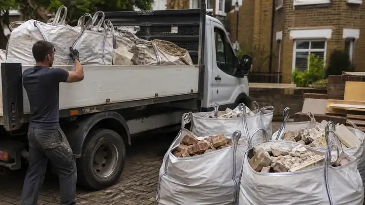 Rubble bags and construction debris being collected from a London refurbishment site.